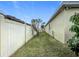 Side yard featuring a well-kept lawn at 123 Vitoria Rd, Davenport, FL 33837