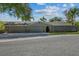 A lovely house with a three-car garage, stone accents, manicured lawn, and ample parking space at 12442 Sunshine Dr, Clermont, FL 34711