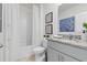 Bright bathroom featuring a shower/tub combo, granite countertop, and modern fixtures at 1251 Big Bass Dr, Ormond Beach, FL 32174