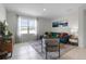 Inviting living area showcasing stylish sofa, textured rug, city skyline art, and ample natural light, creating warm ambiance at 1251 Big Bass Dr, Ormond Beach, FL 32174