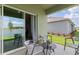 Covered patio with outdoor furniture and a view of the lake at 1251 Big Bass Dr, Ormond Beach, FL 32174