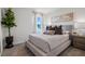 Inviting bedroom featuring a comfortable bed, natural light, and serene decor at 1255 Big Bass Dr, Ormond Beach, FL 32174