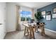 Comfortable home office with a wooden desk, natural light, and an accent wall with decorative art at 1255 Big Bass Dr, Ormond Beach, FL 32174