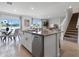 Kitchen island overlooking living room, featuring granite countertops and stainless steel appliances at 1255 Big Bass Dr, Ormond Beach, FL 32174