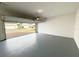 Spacious two-car garage with painted concrete floor at 12615 Salomon Cove, Windermere, FL 34786