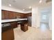 Well-equipped kitchen featuring stainless steel appliances and dark wood cabinets at 12615 Salomon Cove, Windermere, FL 34786