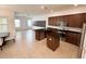 Spacious kitchen featuring stainless steel appliances with an adjacent dining area at 12615 Salomon Cove, Windermere, FL 34786