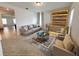 Bright living room featuring tile floors, modern sofa, and stylishly illuminated wine storage at 12615 Salomon Cove, Windermere, FL 34786