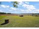 Expansive backyard with direct lake access and a boat cover, ideal for outdoor enthusiasts at 13201 Plum Lake Cir, Minneola, FL 34715