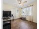 Bedroom featuring natural light, wood floors, ceiling fan, and computer desk at 133 Hillcrest Dr, Davenport, FL 33897