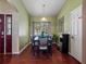 A formal dining room with a dark wood table and seating for six highlighted by modern decor at 133 Hillcrest Dr, Davenport, FL 33897