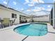 A lovely screened-in pool area with outdoor seating perfect for relaxation and entertainment at 133 Hillcrest Dr, Davenport, FL 33897