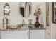 Close-up of a bar area with a granite countertop, ornate mirror, and decorative accessories at 1355 S Summerlin Ave, Orlando, FL 32806