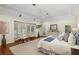 Bright main bedroom with bay window seating area and wood floors at 1355 S Summerlin Ave, Orlando, FL 32806