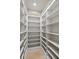 Walk-in pantry featuring custom shelving for optimal storage and organization at 1355 S Summerlin Ave, Orlando, FL 32806