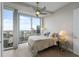 Serene bedroom features city views from floor-to-ceiling windows and neutral decor at 150 E Robinson St # 2602, Orlando, FL 32801