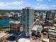 Exterior view of community's modern high-rise building in a cityscape with lake views at 150 E Robinson St # 2602, Orlando, FL 32801