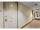 Hallway view showcasing unit 602, with neutral walls and a carpeted floor at 150 E Robinson St # 2602, Orlando, FL 32801