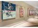 Art gallery hallway featuring modern paintings and sleek design with a terrazzo floor at 150 E Robinson St # 2602, Orlando, FL 32801