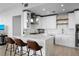 Modern kitchen with white cabinetry, marble countertops, and pendant lighting at 150 E Robinson St # 2602, Orlando, FL 32801