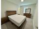 Cozy bedroom featuring carpet, neutral colors and matching wood furniture set at 18417 Oliver Twist Way, Winter Garden, FL 34787