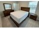 Bright, neutral bedroom with complete dark wood furniture set and plush carpeting at 18417 Oliver Twist Way, Winter Garden, FL 34787