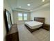 Bedroom with wood floors and neutral decor at 18417 Oliver Twist Way, Winter Garden, FL 34787