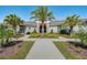 Beautiful community clubhouse with lovely landscaping and palm trees at 18417 Oliver Twist Way, Winter Garden, FL 34787