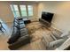 Living room featuring large windows, hardwood floors, and a large sectional sofa at 18417 Oliver Twist Way, Winter Garden, FL 34787