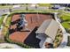 Aerial view of a well-maintained community playground with slides, swings, and a picnic pavilion at 18417 Oliver Twist Way, Winter Garden, FL 34787