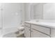 Bathroom with a shower-tub combo and a vanity with a white countertop at 18955 Rawson St, Orlando, FL 32827