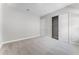 Carpeted bedroom featuring a closet with sliding doors and a separate doorway at 18955 Rawson St, Orlando, FL 32827