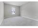 Cozy bedroom featuring neutral carpet flooring and a bright window at 18955 Rawson St, Orlando, FL 32827