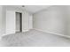 Bedroom featuring neutral carpet flooring and a closet with sliding doors at 18955 Rawson St, Orlando, FL 32827