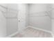 Walk-in closet with ample shelving and storage space at 18955 Rawson St, Orlando, FL 32827