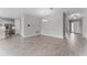 Bright dining area with wood-look tile floors, chandelier, and open layout at 18955 Rawson St, Orlando, FL 32827