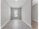 The interior view reveals an open floor plan with wood-look tile floors and neutral paint at 18955 Rawson St, Orlando, FL 32827