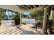 Exterior courtyard with pergola, showcasing well-maintained landscaping and a view of the parking area at 1948 Lake Atriums Cir # 113, Orlando, FL 32839