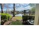 Scenic water view overlooking the lake with lush greenery and community buildings in the background at 1948 Lake Atriums Cir # 113, Orlando, FL 32839