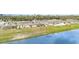 Enjoy this aerial view of the neighborhood by the lake at 2032 Buckhanon Trl, Deland, FL 32720