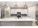 Modern kitchen with stainless steel appliances, white cabinetry and large island at 2032 Buckhanon Trl, Deland, FL 32720