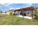 Backyard patio area with a pergola at 2032 Buckhanon Trl, Deland, FL 32720