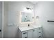 Bright bathroom with a quartz vanity, modern lighting, and black hardware accents at 2121 5Th Ave, Deland, FL 32724