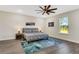 Bedroom featuring a cozy bed, a window with outdoor view, and decor at 2121 5Th Ave, Deland, FL 32724