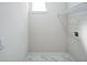 Laundry room featuring white walls, marble tile floors, wire shelving, and hookups at 2121 5Th Ave, Deland, FL 32724