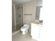 Bright bathroom features a tiled stand up shower, tile floors, and modern sink at 231 Riverside Dr # 1510-1, Daytona Beach, FL 32117