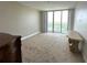 Spacious bedroom with carpet, a large window with a view, and furniture at 231 Riverside Dr # 1510-1, Daytona Beach, FL 32117