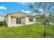 A charming backyard with new sod, covered patio and a tree at 2321 Tay Wes Dr, St Cloud, FL 34771