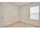 Empty carpeted bedroom with two doors and a window at 2321 Tay Wes Dr, St Cloud, FL 34771