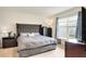 Cozy bedroom featuring a grey upholstered headboard, and natural light at 2321 Tay Wes Dr, St Cloud, FL 34771